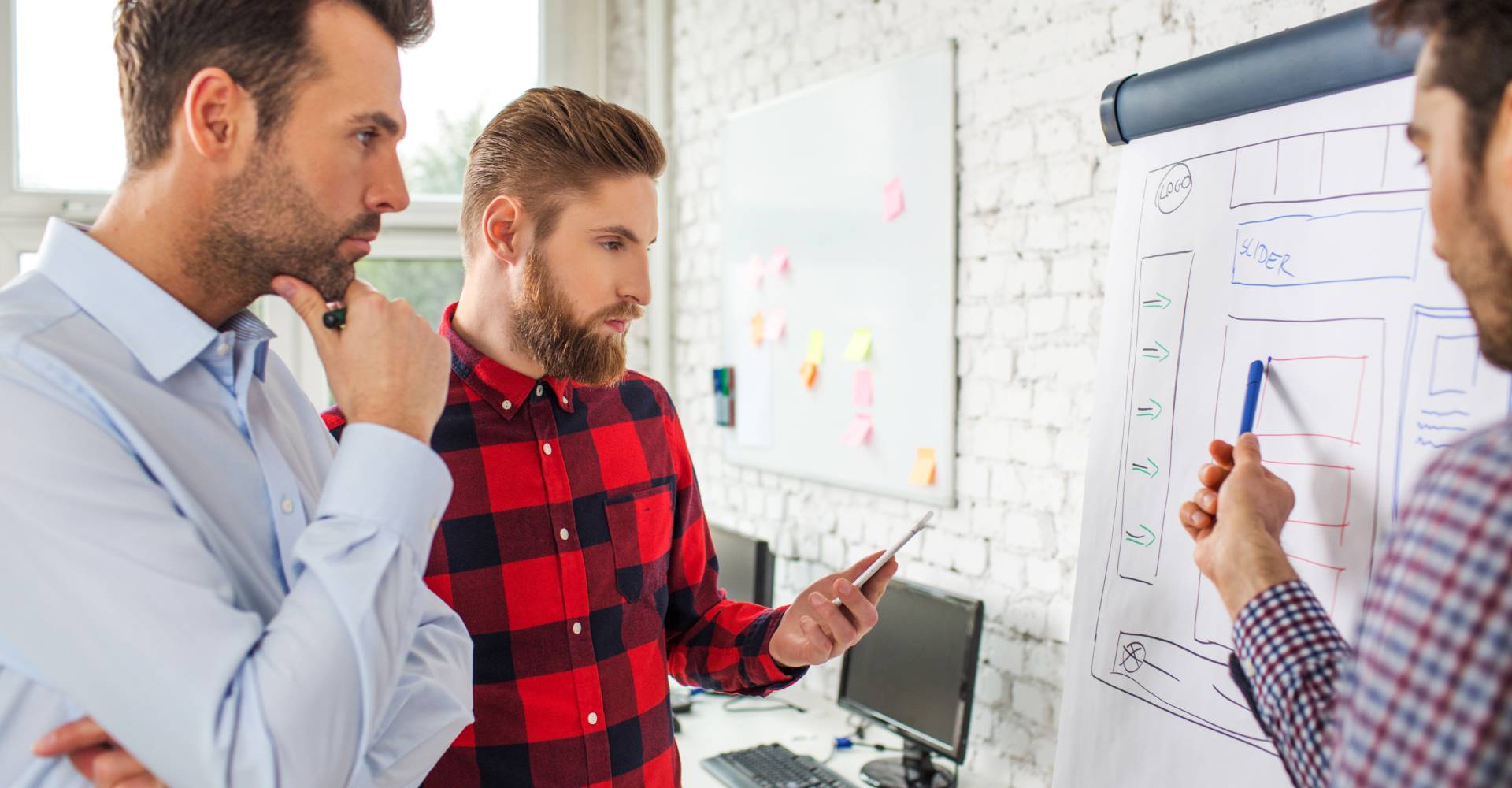 DevOps team discussing pipeline automation design