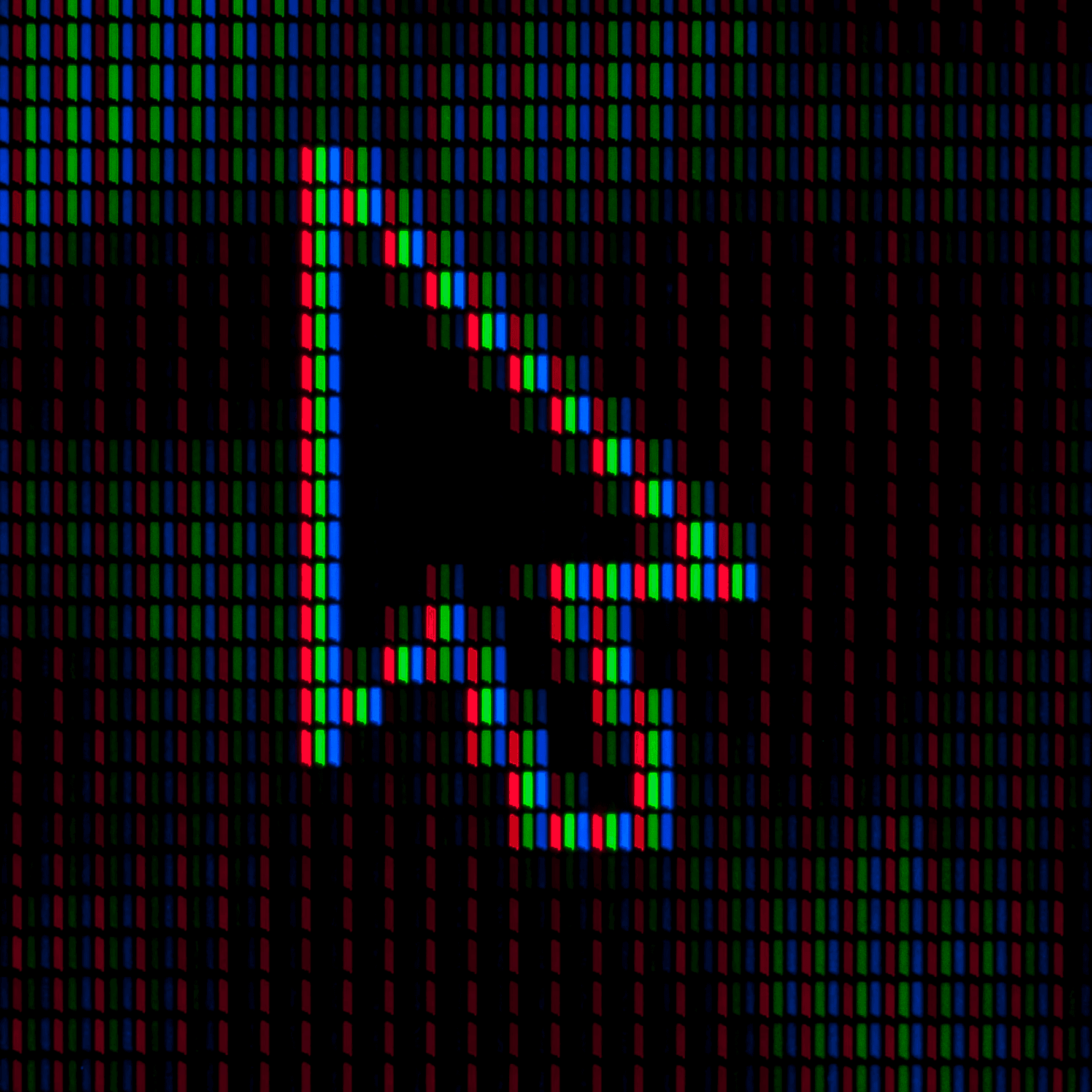 Close-up of a computer screen displaying a magnified view of a mouse cursor with visible pixels